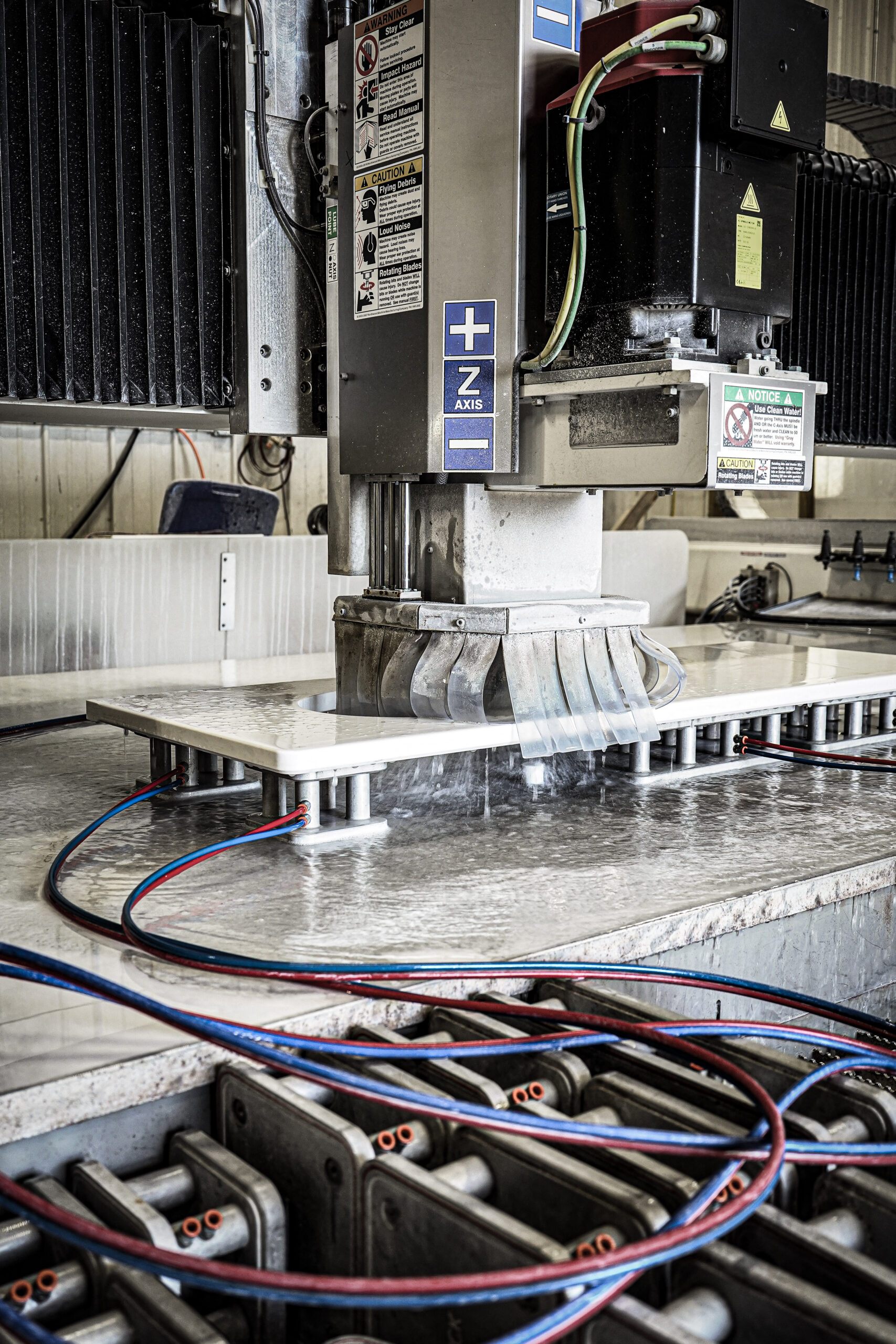 CNC router cutting a countertop in the GranitePro facility