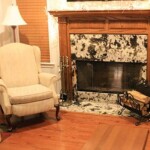 Fireplace with a dark multicolor stone surround