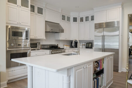 White kitchen with a white countertop island